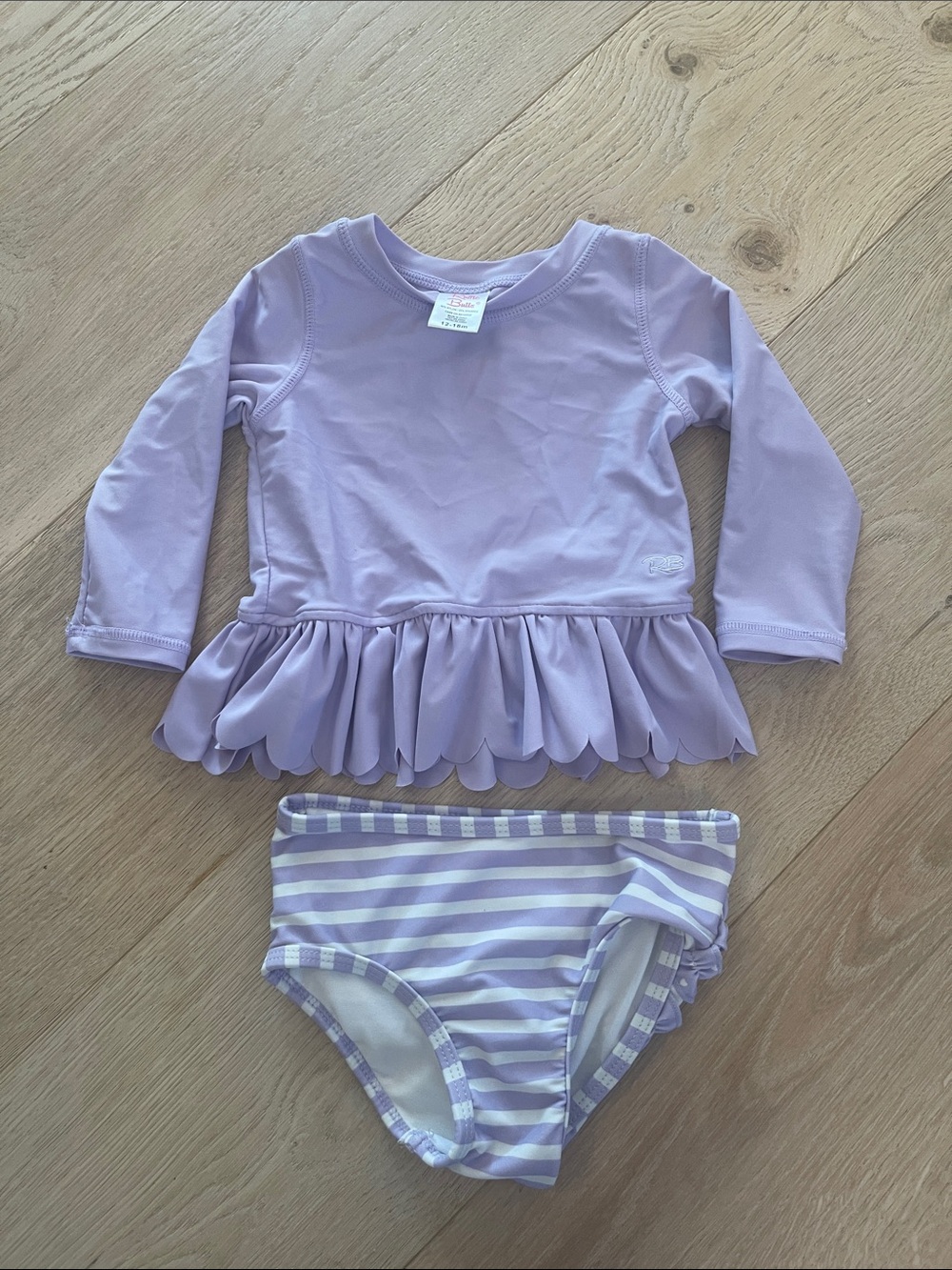 Ruffle Butts Lilac Long-Sleeve Peplum Rash Guard with Striped Bottoms